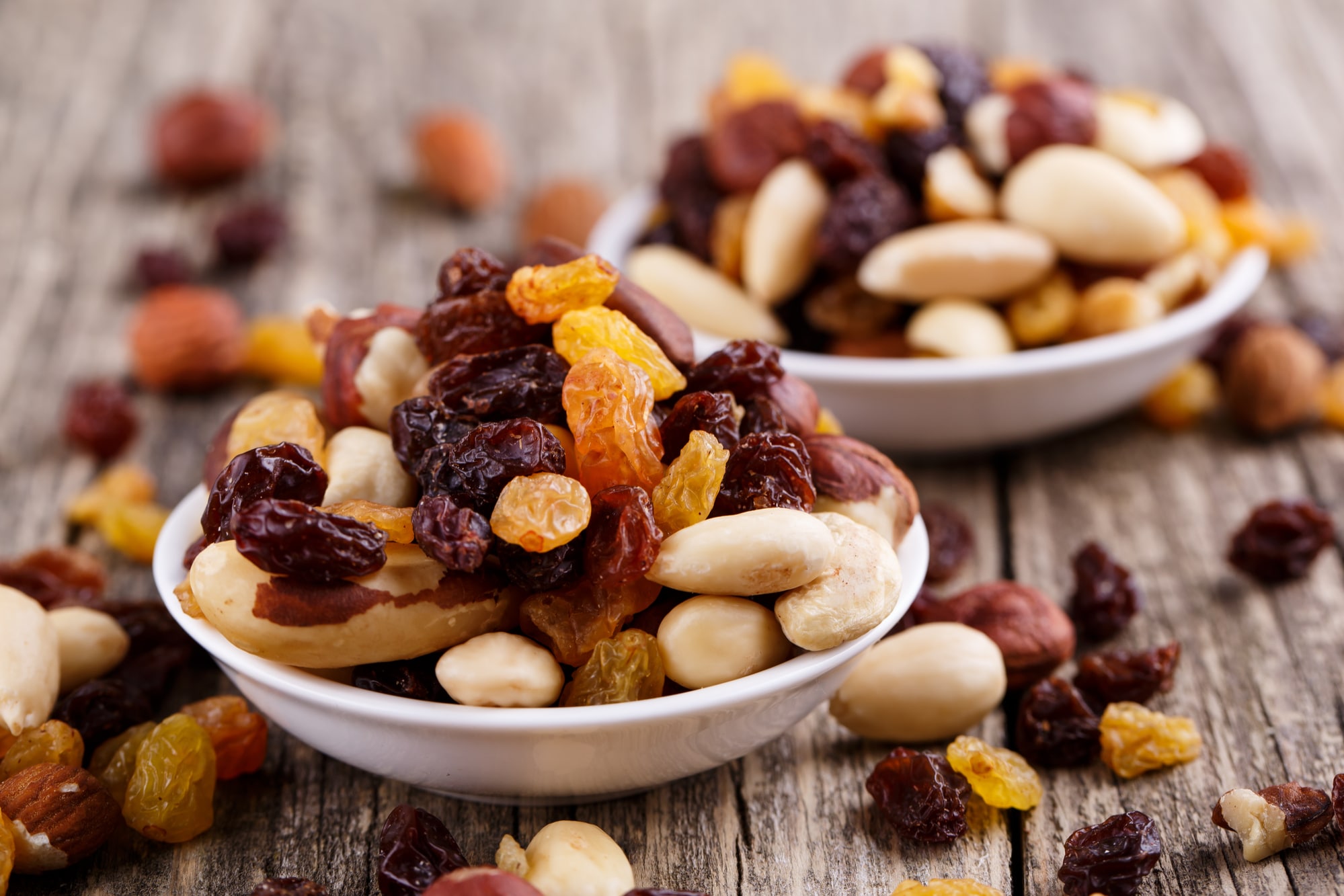 Mixed nuts on a white plate.